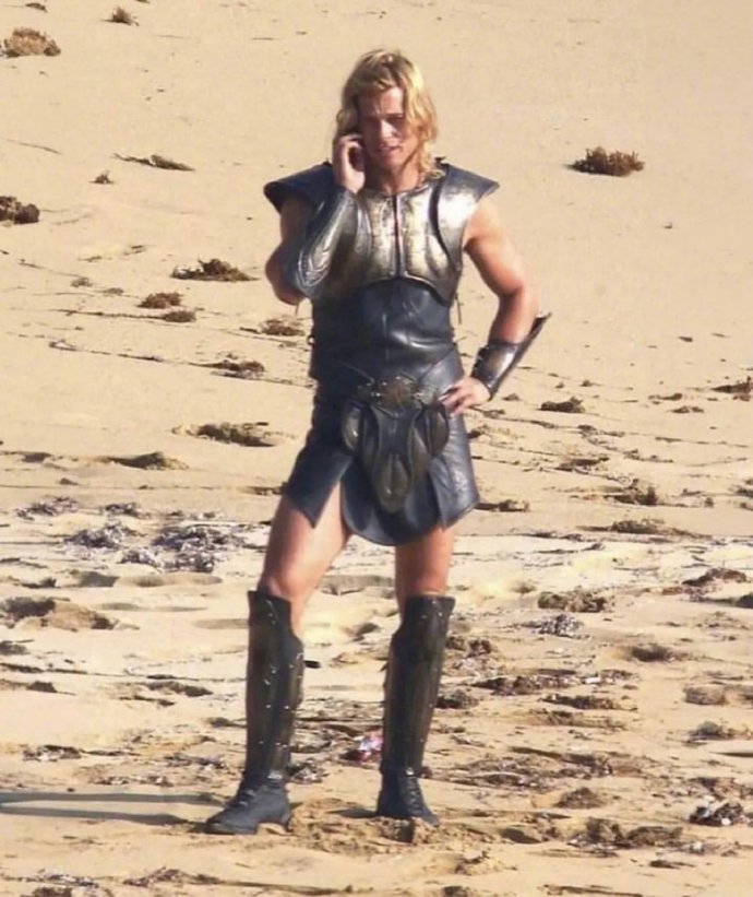 Brad Pitt talking on his cell phone on the set of Troy in 2004.