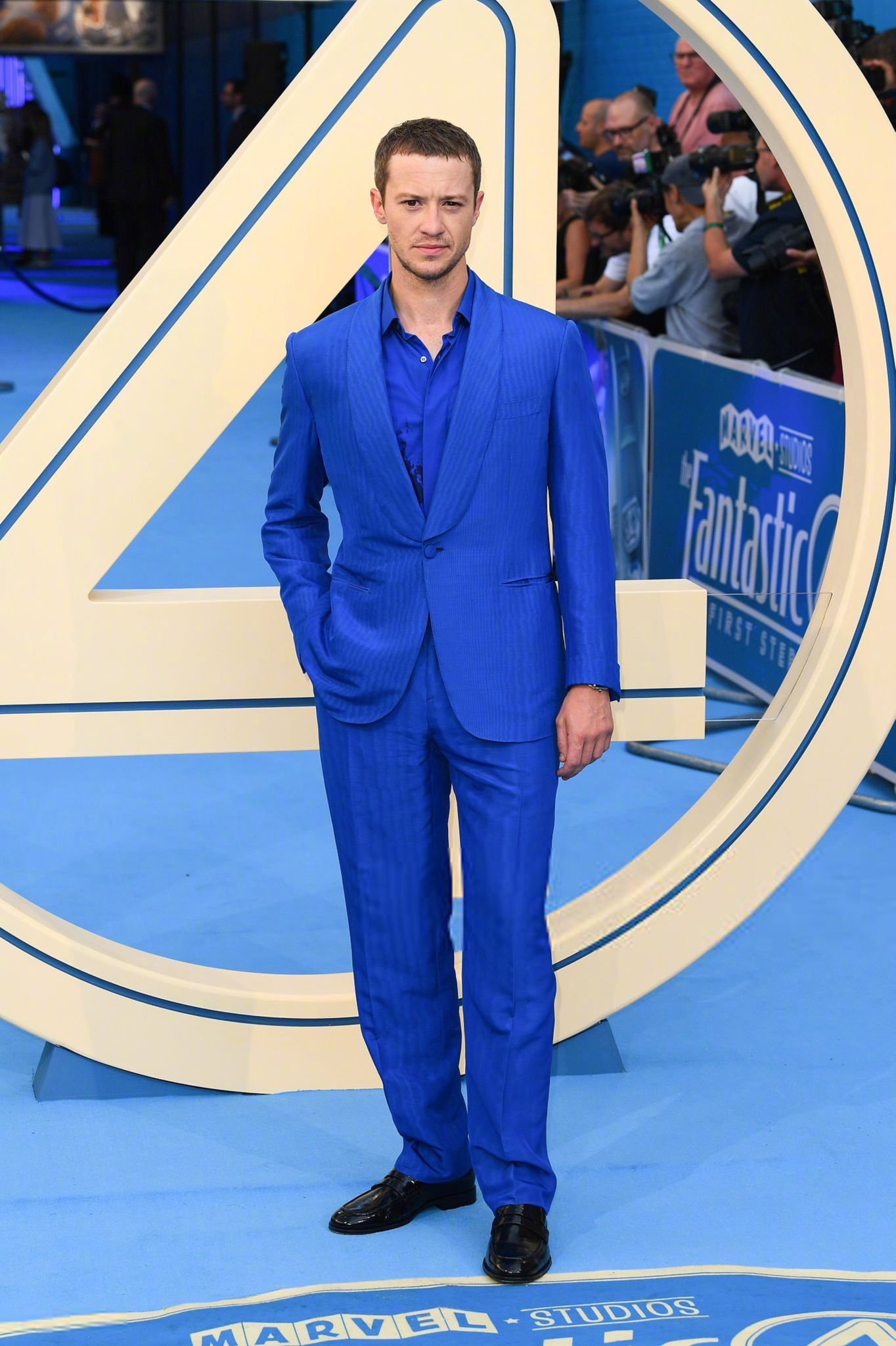 Joseph Quinn looks slim and handsome in a vibrant  blue suit