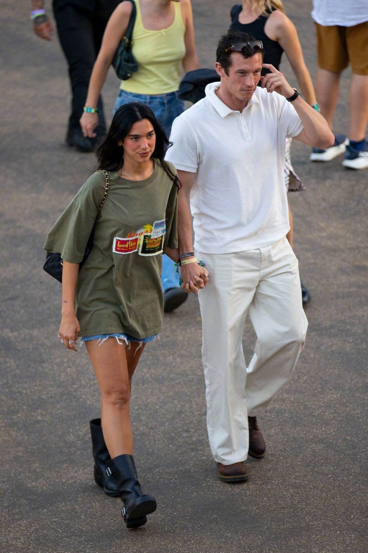 Dua Lipa (graphic t-shirt & denim shorts) and Callum Turner at BST Hyde Park Festival