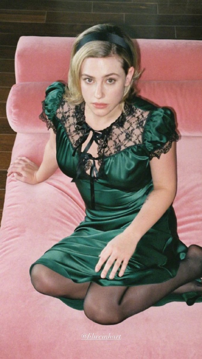 Lili Reinhart wearing elegant green dress paired with lace