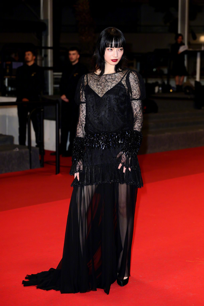 Nana Komatsu in a black sheer long dress.
