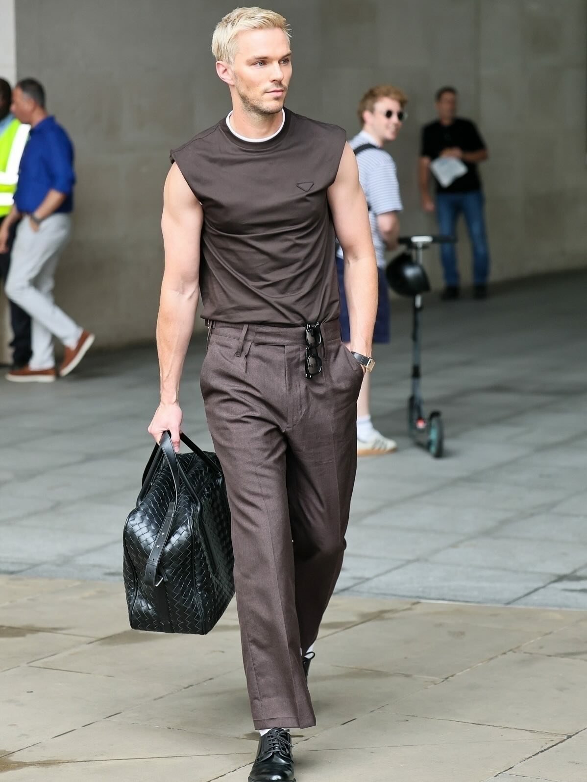 Nicholas Hoult in sleeveless top & tailored trousers