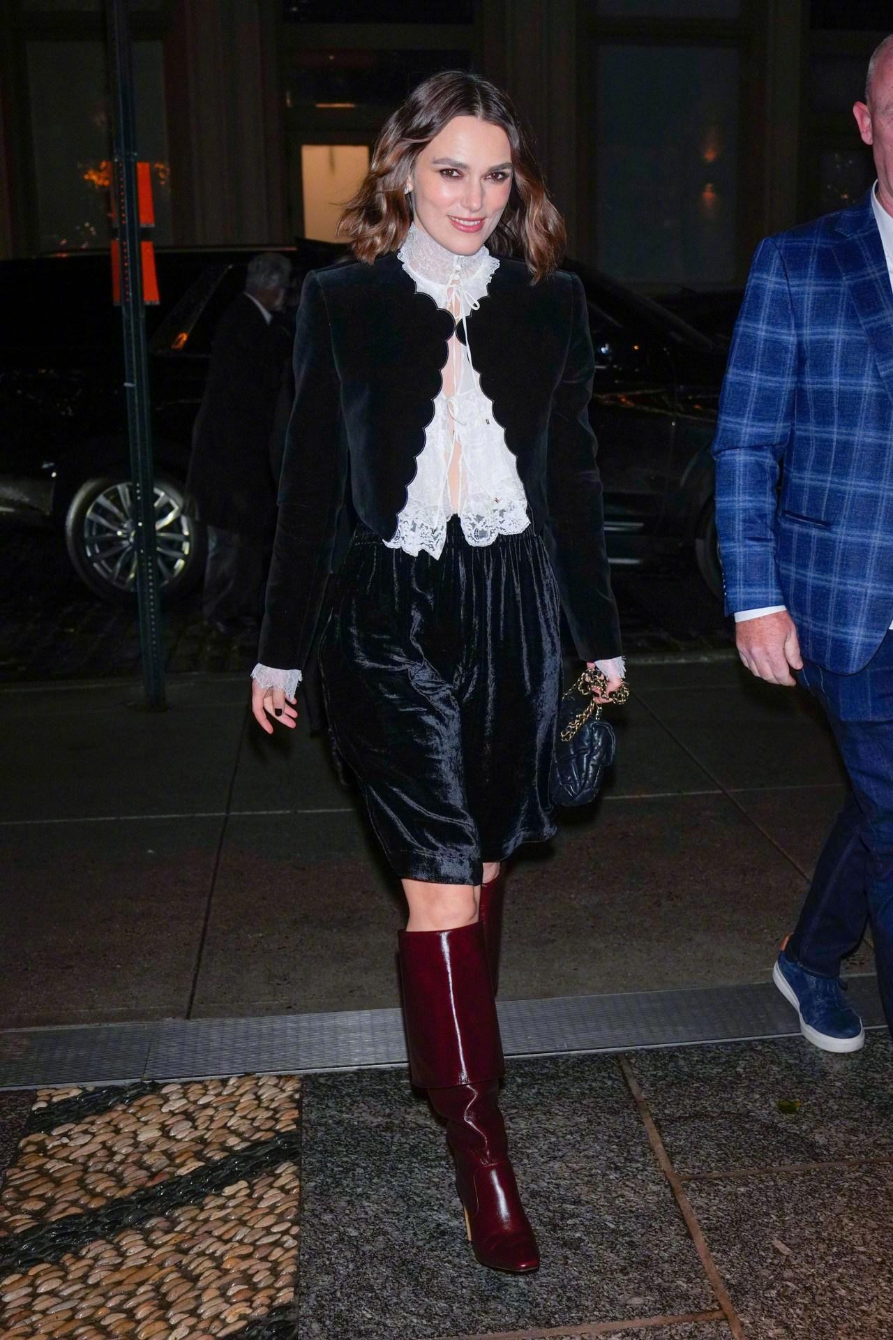 Keira Knightley wore a velvet suit by Chloé, paired with a white lace high-neck blouse.