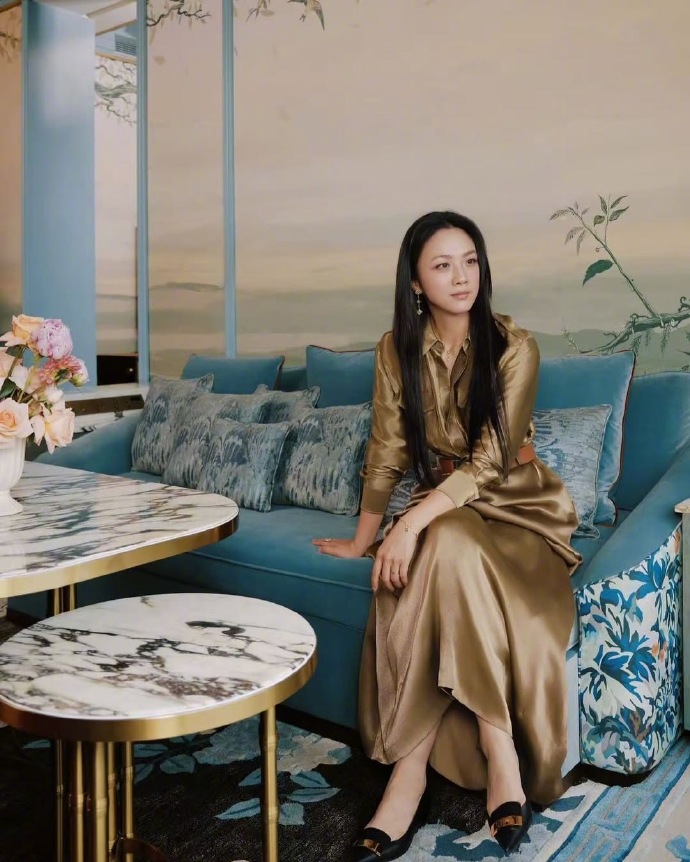 The golden dress Tang Wei is wearing is from Ralph Lauren