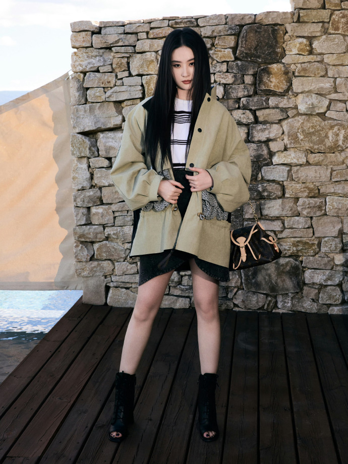 Liu Yifei wears a utility jacket and mini skirt from Louis Vuitton’s Fall/Winter 2025 collection.