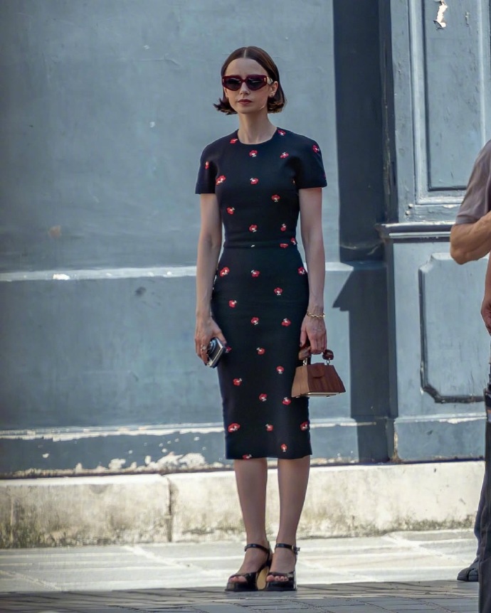 Lily Collins spotted on the streets of Paris filming Season 5 of *Emily in Paris*.