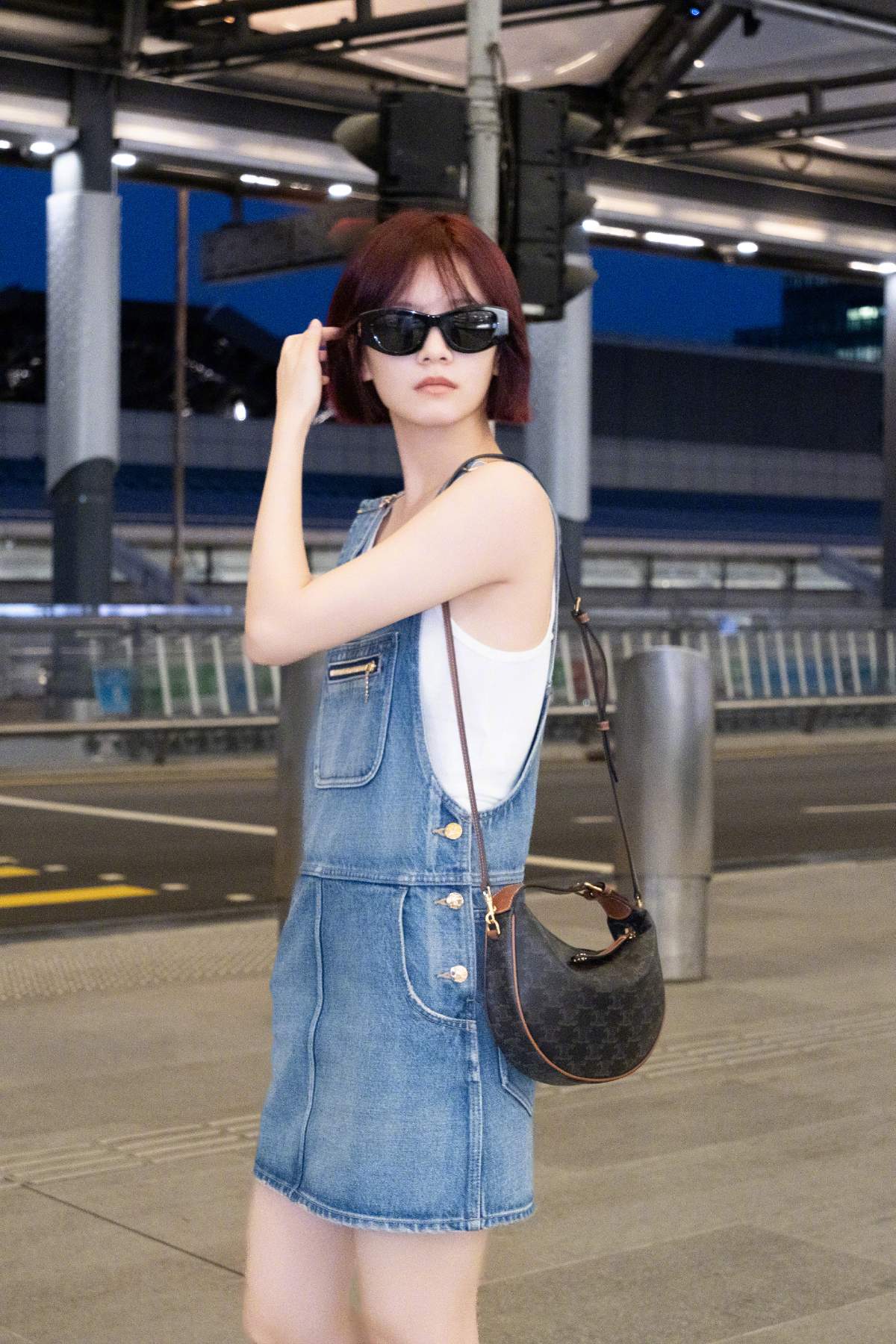 Elegant denim dress paired with tank top