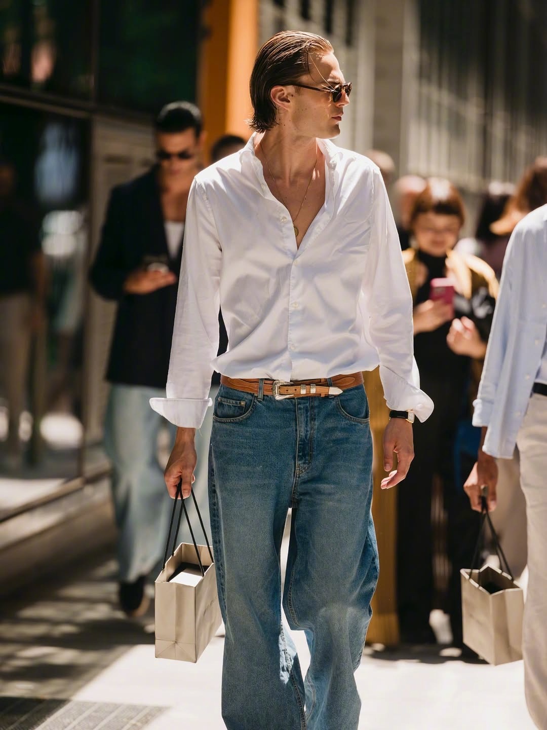A stylish and dashing Giorgio Armani male model spotted off-duty on the street.