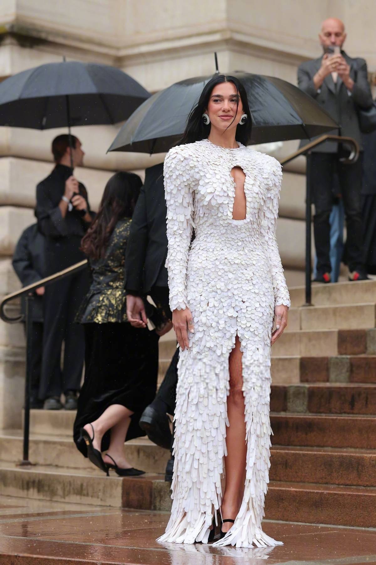 Dua Lipa wears a keyhole cut-out dress from Schiaparelli 2024 Spring/Summer Haute Couture collection