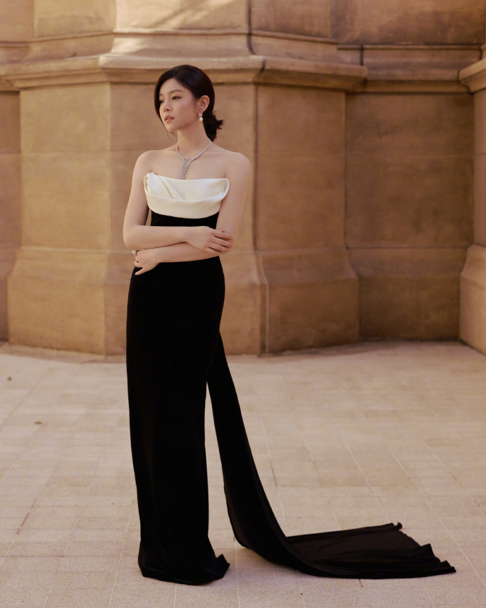 Michelle Chen in a strapless gown with a train