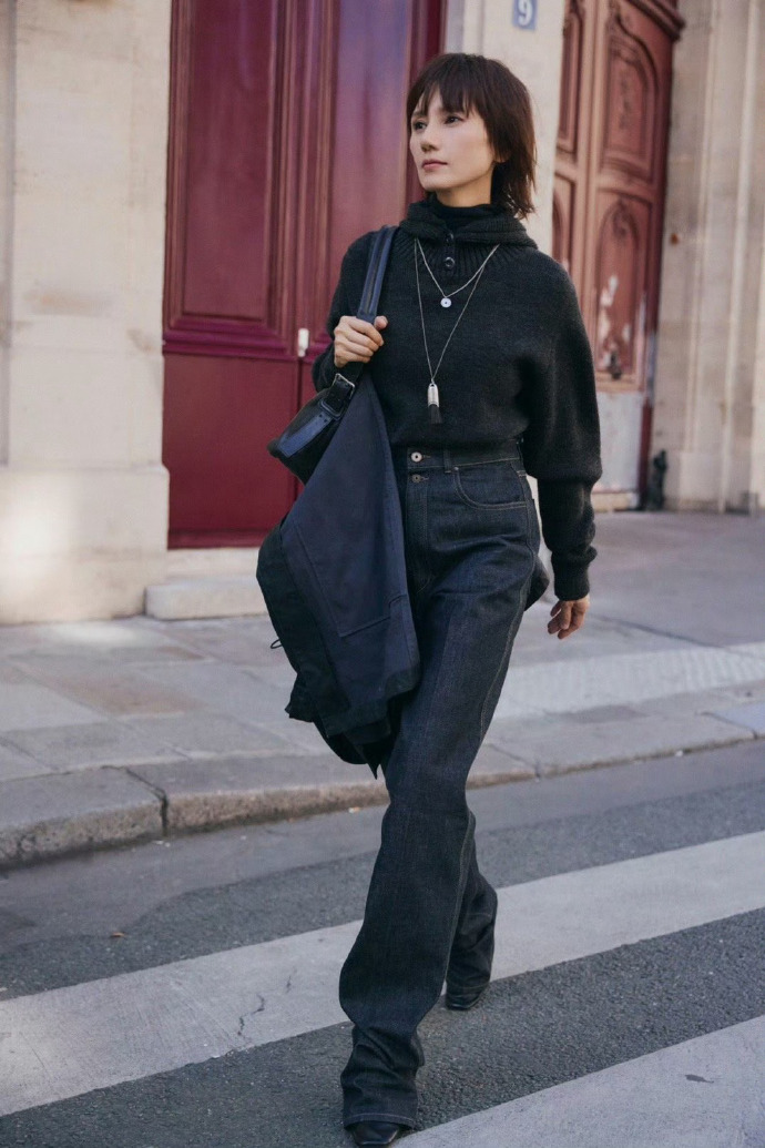 Yuan Quan in turtleneck sweater paired with wide-legged jeans