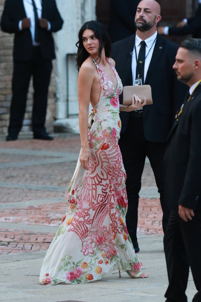 Kendall Jenner in  halter floral dress attends Jeff Bezos wedding in Venice