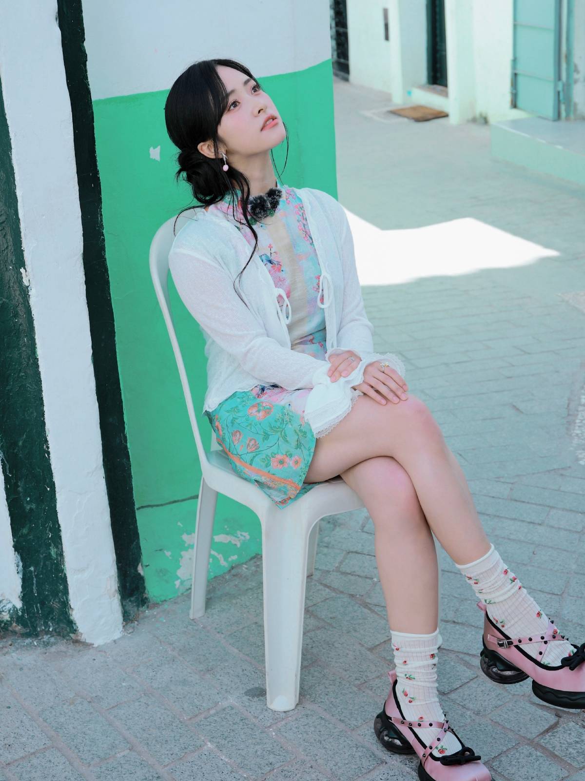 Shen Yue in floral mini dress paired with cardigan