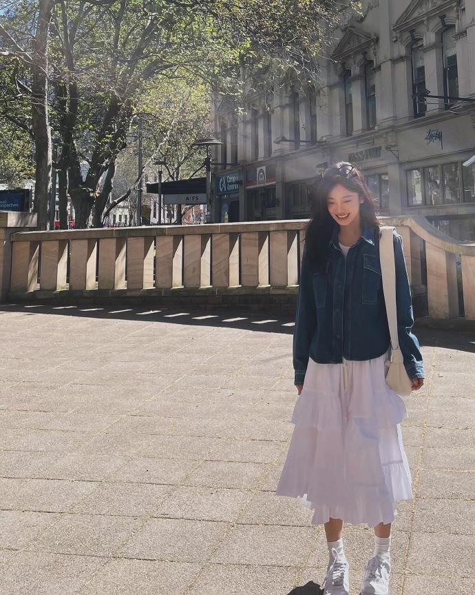 Denim jacket with  light pink purple skirt