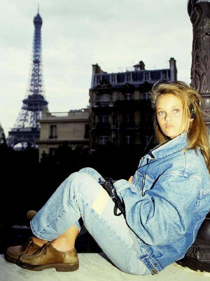 Vanessa Paradis in Paris, 1990 — sitting on a windowsill in a full denim outfit.