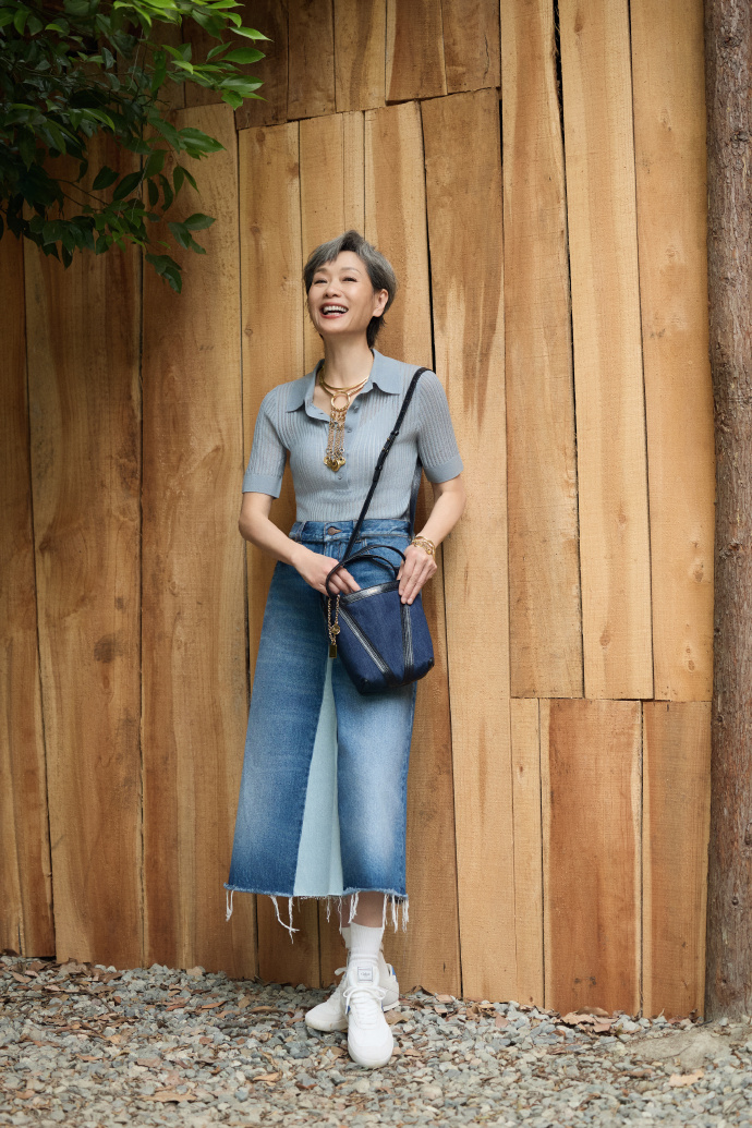 Elegant knit top paired with denim skirt