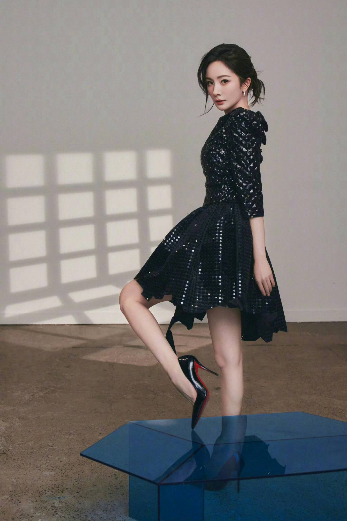 Black sequin dress & red bottom high heels