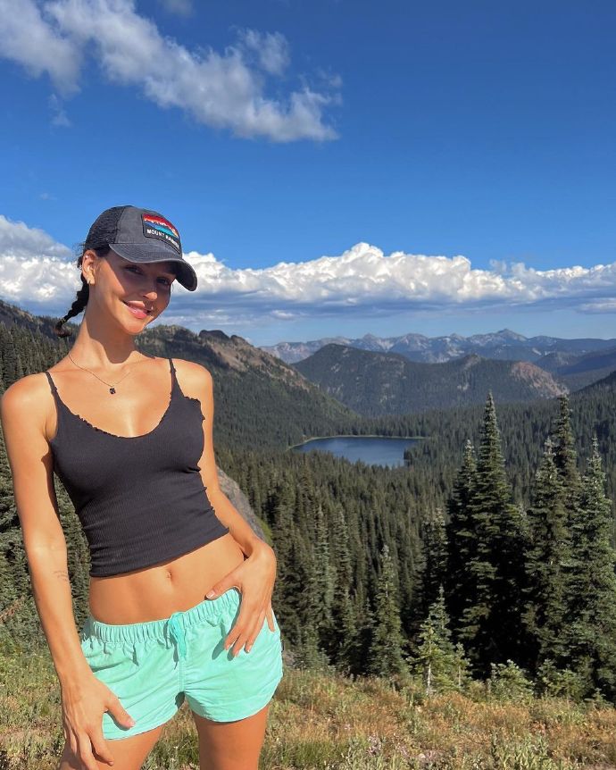 Tank top with shorts. Hot and stylish summer outdoor outfit.