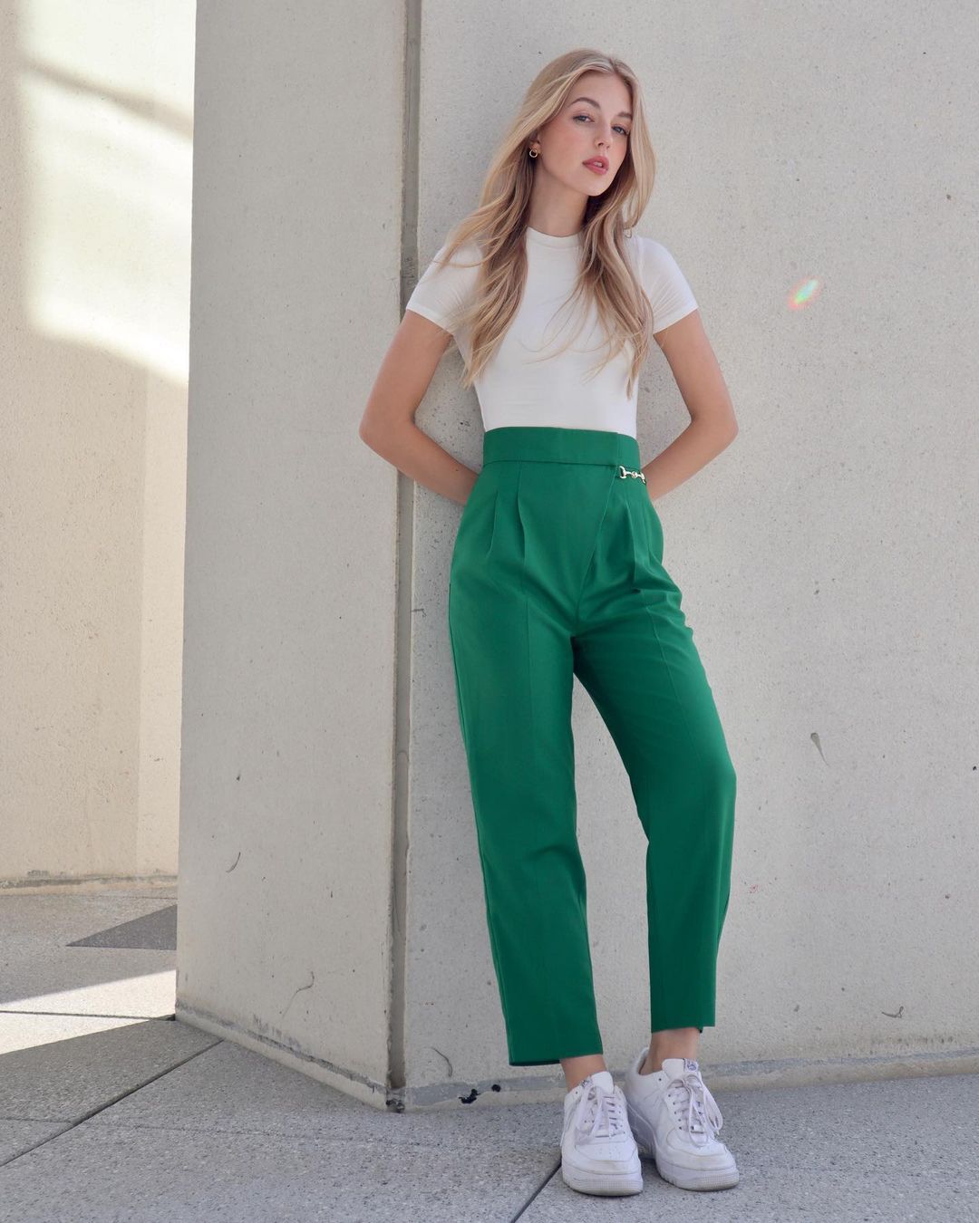 Gabby Thomas. Elegant t-shirt paired with high-waisted trousers
