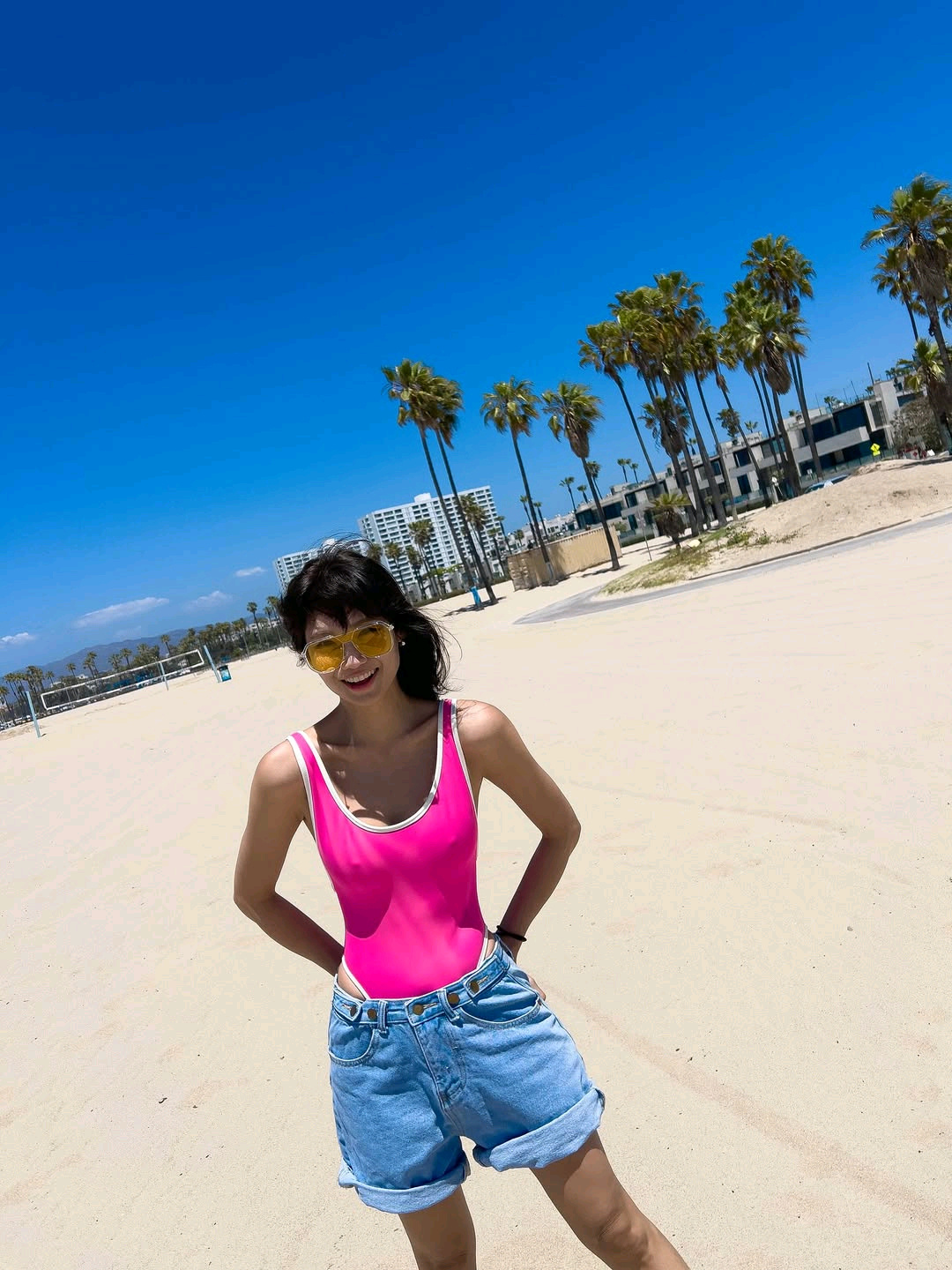 Leeheeun at the beach, swimsuit and denim shorts