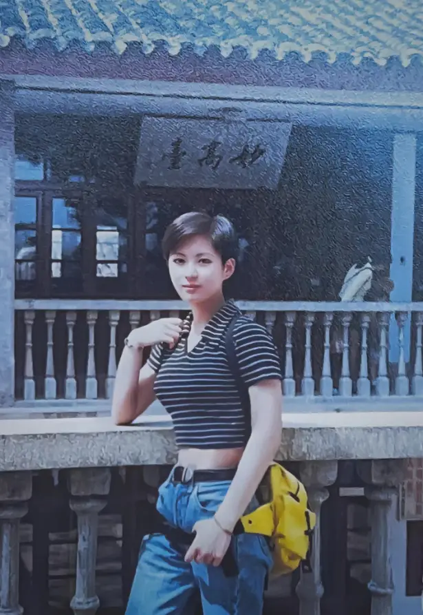 In 1996, a young Chinese girl wearing a fashionable midriff-baring outfit.