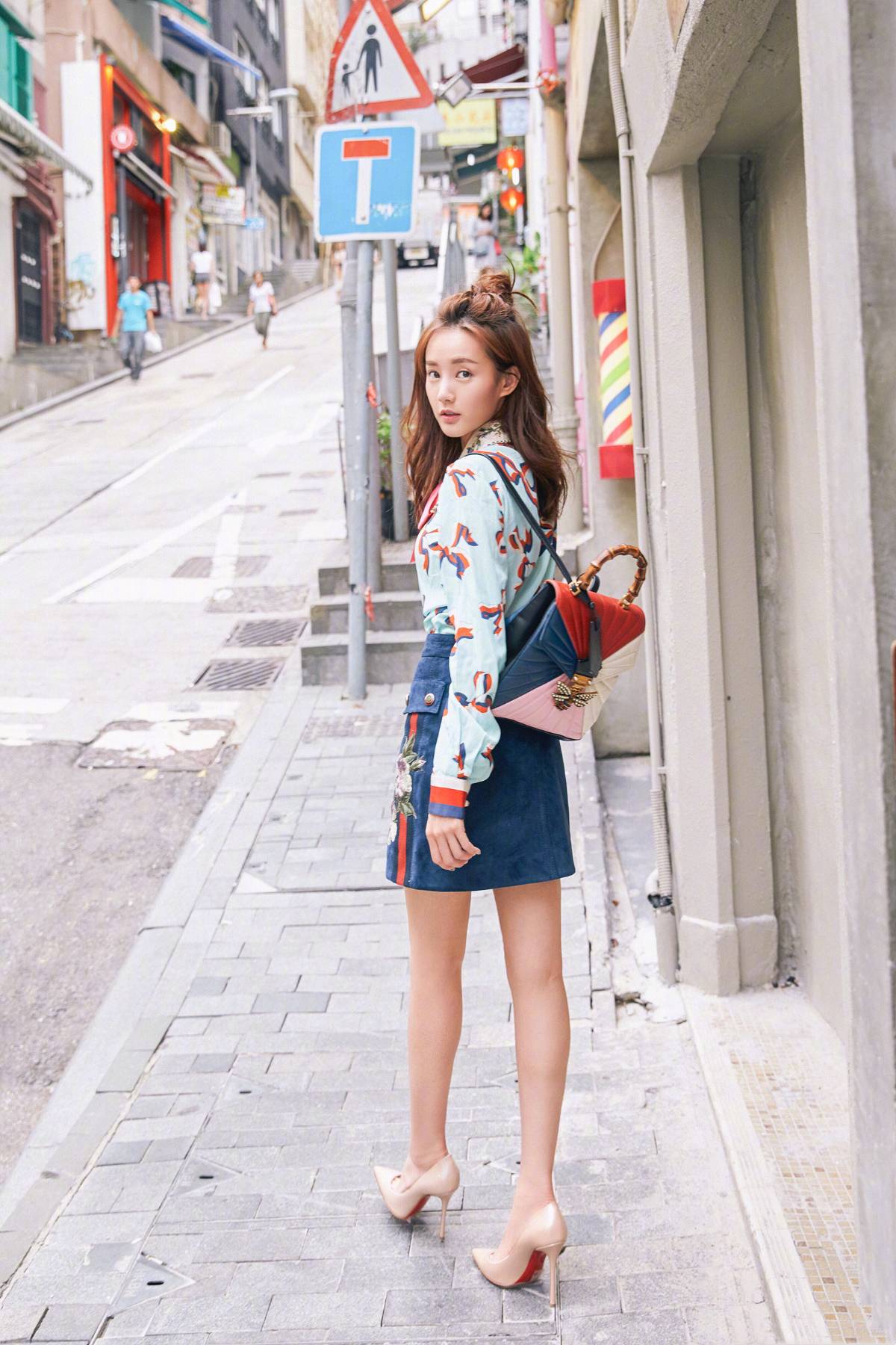 Long-sleeve blouse paired with mini skirt
