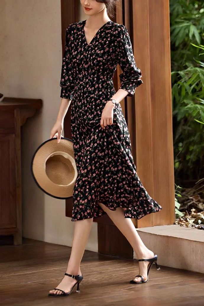 A sun hat, strappy high-heeled sandals, and a floral dress — one of the most elegant summer outfit combinations for womens.