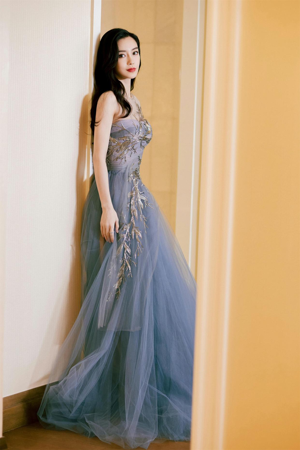 A gold embroidered strapless tulle gown
