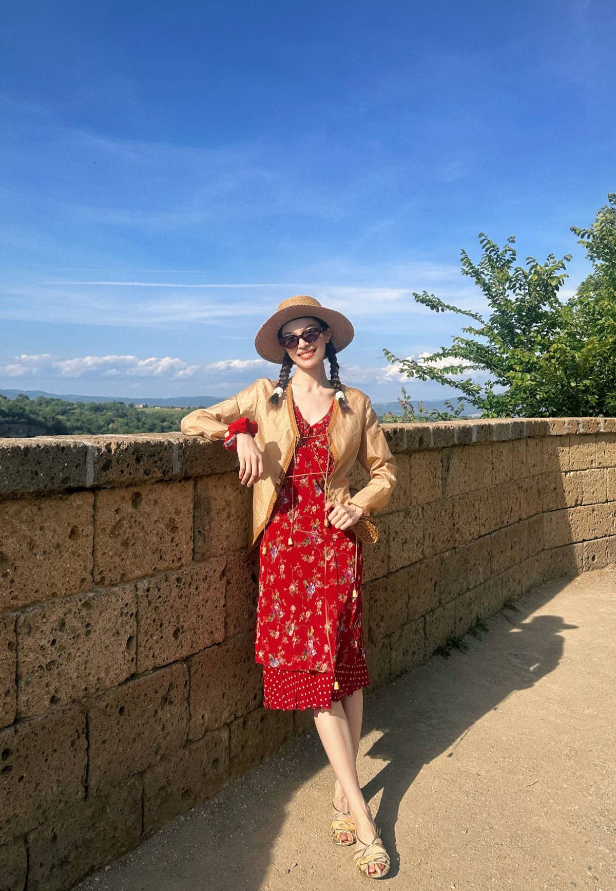Elegant floral dress paired with straw hat