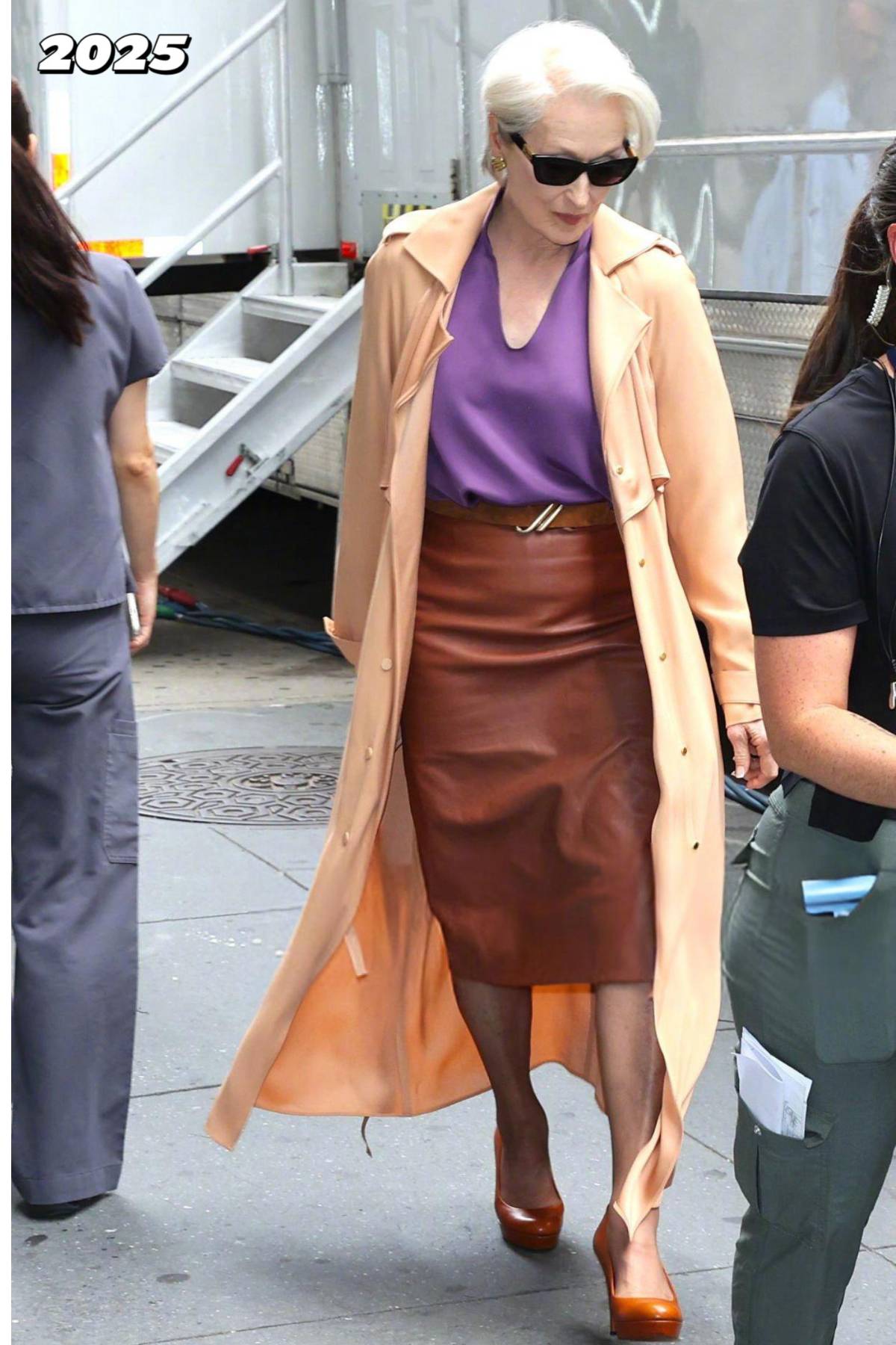 Meryl Streep in The Devil Wears Prada 2. Stylish trench coat and pencil skirt
