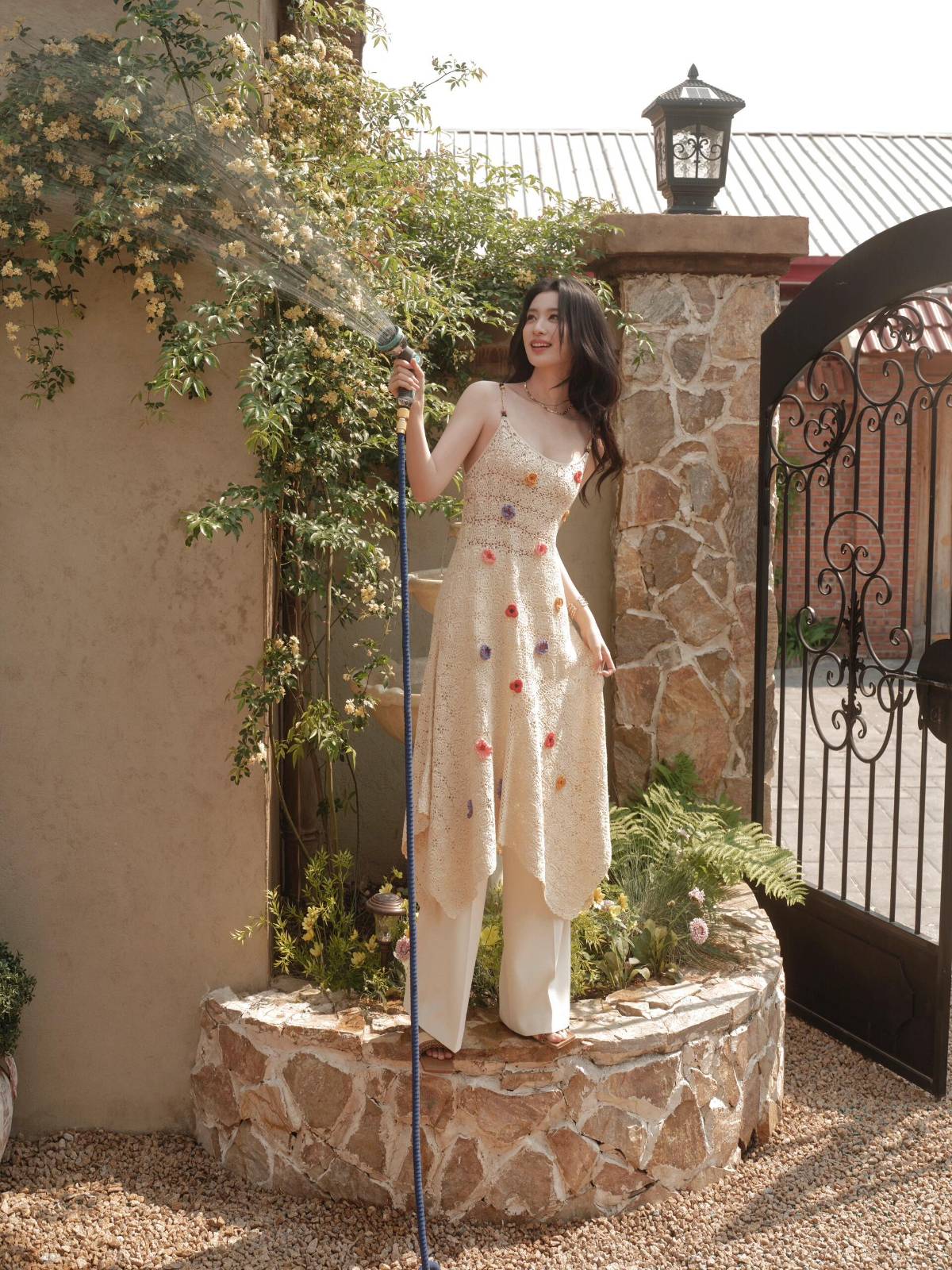 Spaghetti straps crochet dress and wide-legged trousers