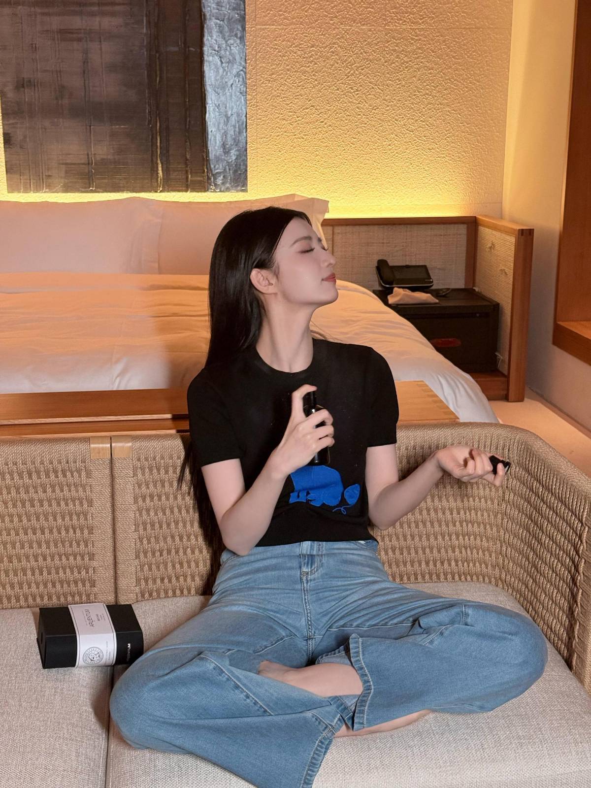 Elegant black graphic t-shirt paired with blue jeans