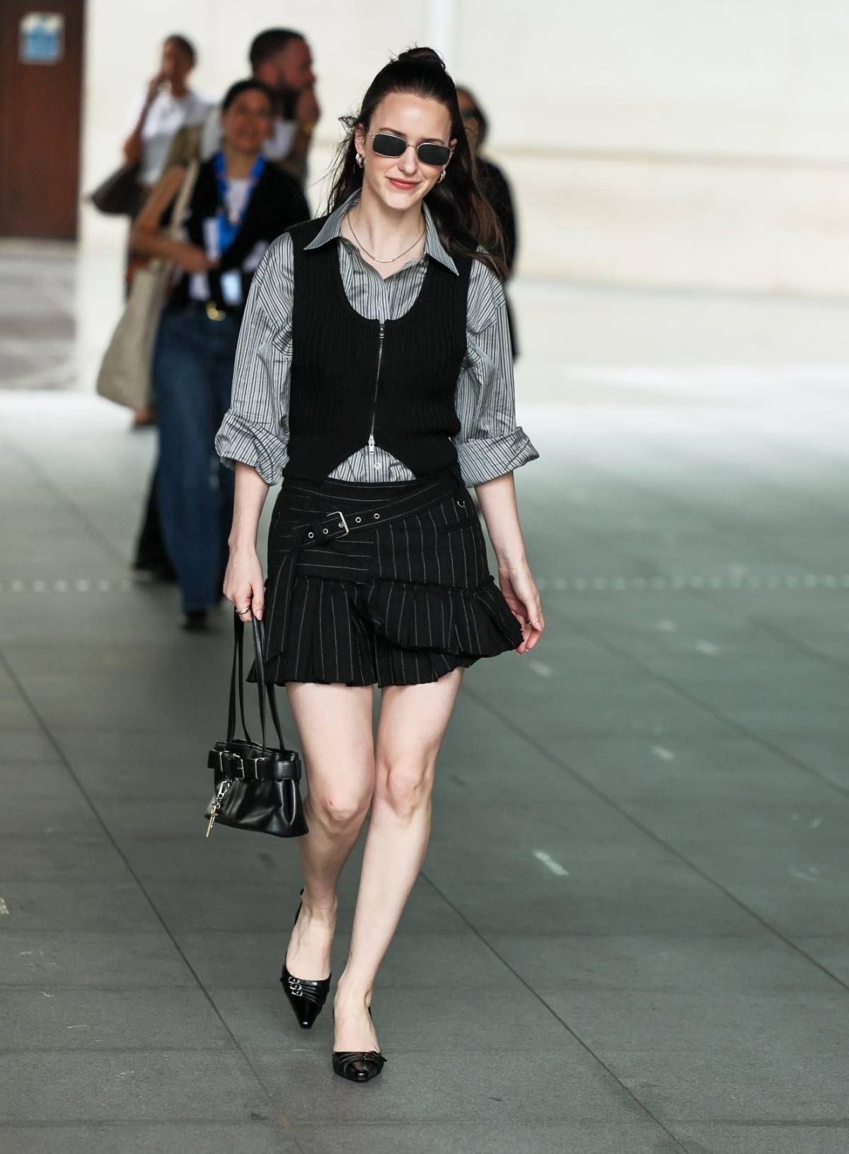 Rachel Brosnahan in pinstripe shirt & mini skirt