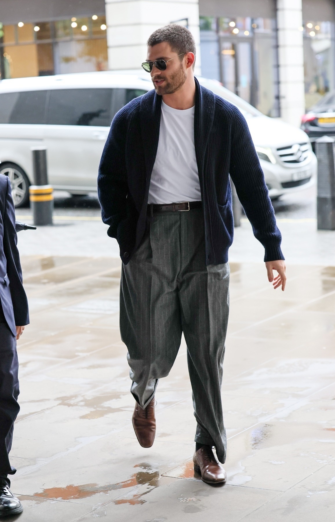 David Corenswet in cardigan & pleated trousers combination