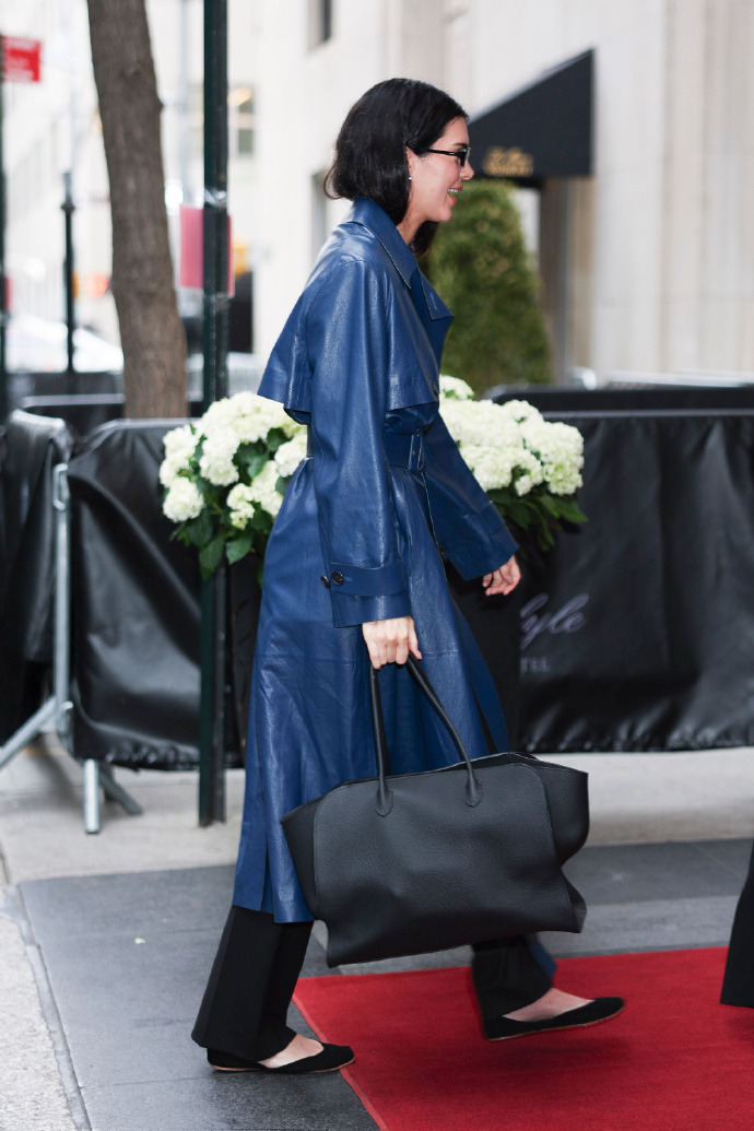 Kendall Jenner in a blue trench coat outfit.