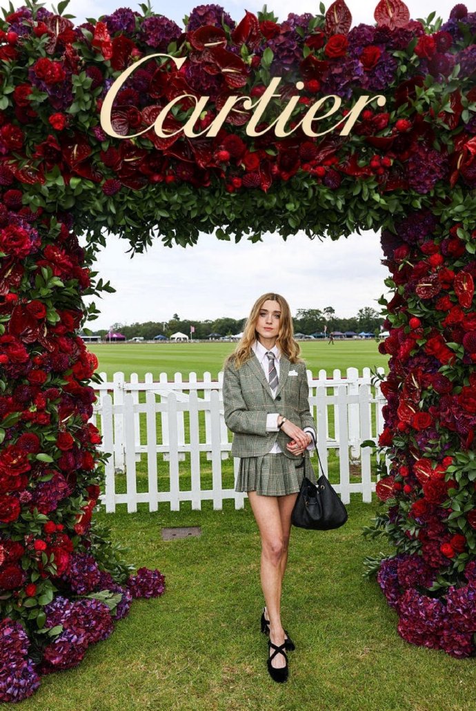 Natalia Dyer's outfit has a strong preppy vibe.