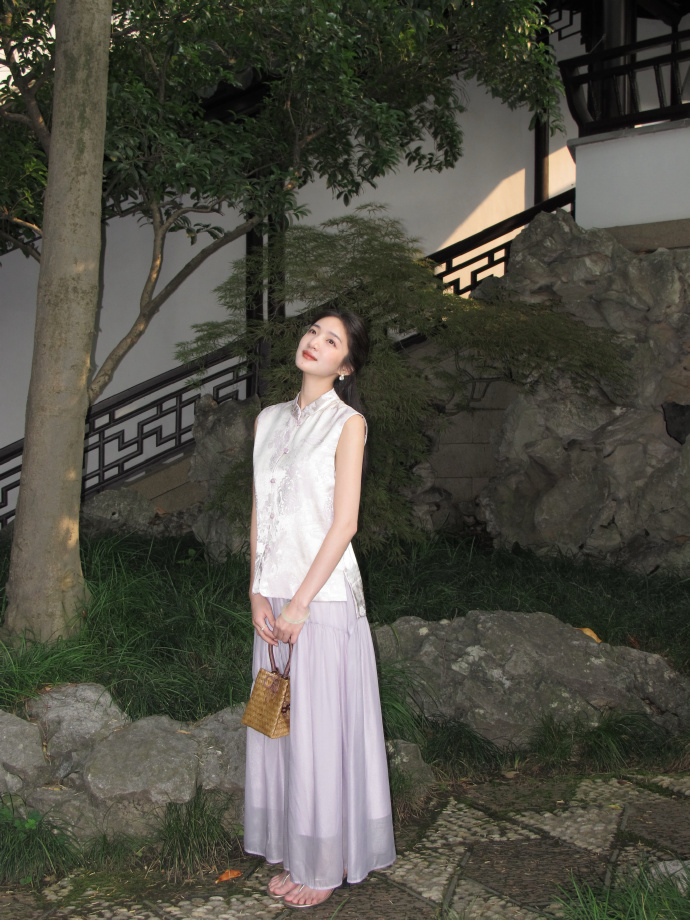 A touch of Eastern charm. Stylish satin sleeveless top and mauve maxi skirt