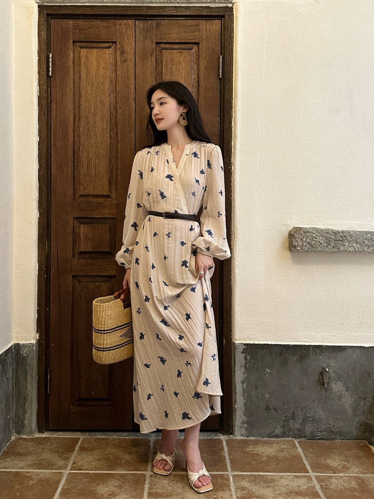 Elegant Cream Midi Dress with Floral Patterns and Woven Accessories for a Chic Day Look