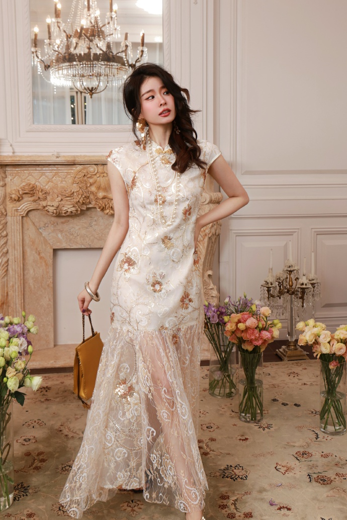 A long floral lace dress with a sheer hem.