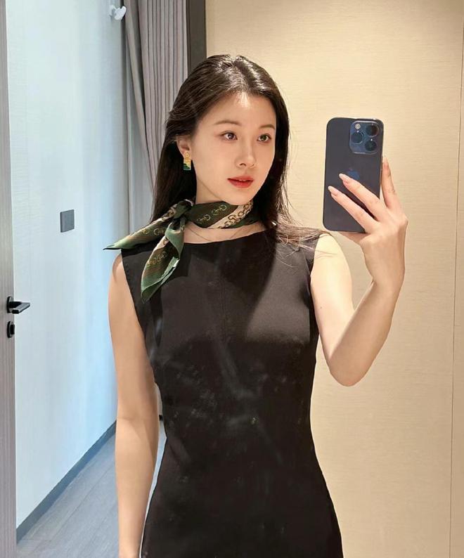A black skirt suit with a scarf — super cute and stylish!