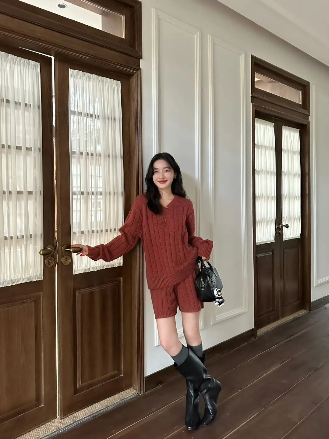 Cozy Rust Knit Ensemble with Black Boots for a Chic Autumn Look