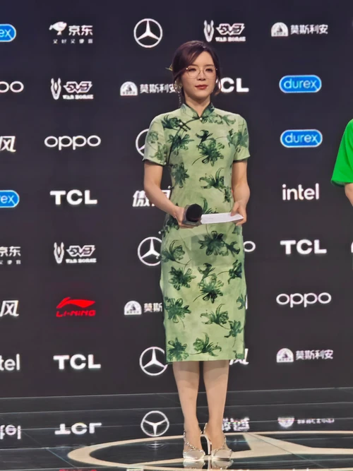 Elegant Green Qipao with Botanical Motif Paired with Chic Embellished Heels