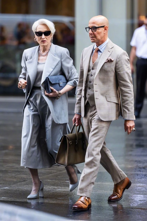 Stills from *The Devil Wears Prada 2*: Elegant Coordination with Light Gray Suit and Light Brown Checkered Suit Featuring Sleek Accessories