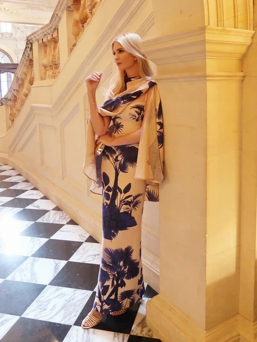 Ivanka's Latest Photo Rating: Elegant Botanical Print Dress with Navy and Beige Tones Paired with a Draped Cape