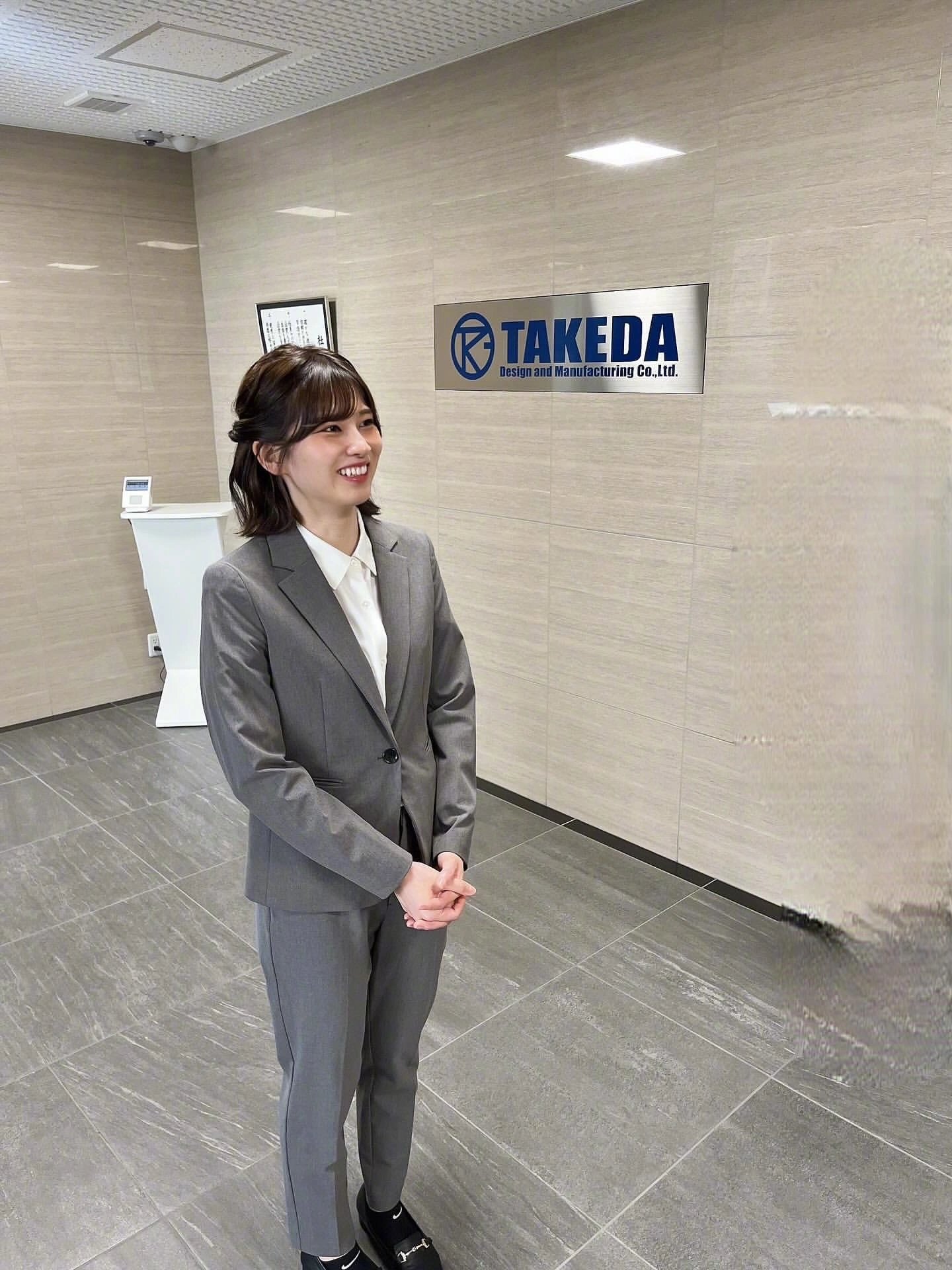 A cute Japanese girl (INS: SAO). Professional Gray Suit with White Shirt for a Sleek Office Look