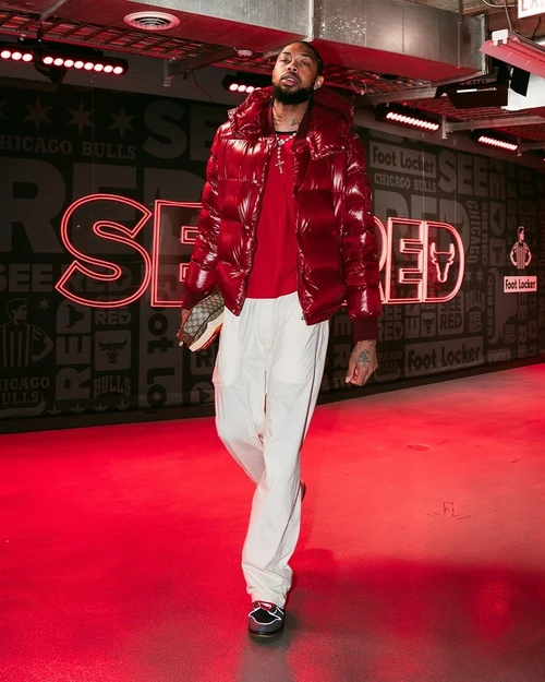 Brandon Ingram's Outfit: Bold Red Puffer Jacket and Casual White Pants for a Trendy Urban Look