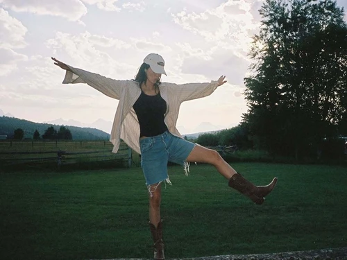 Kendall Jenner OOTD: Striped Oversized Shirt with Denim Shorts and Cowboy Boots