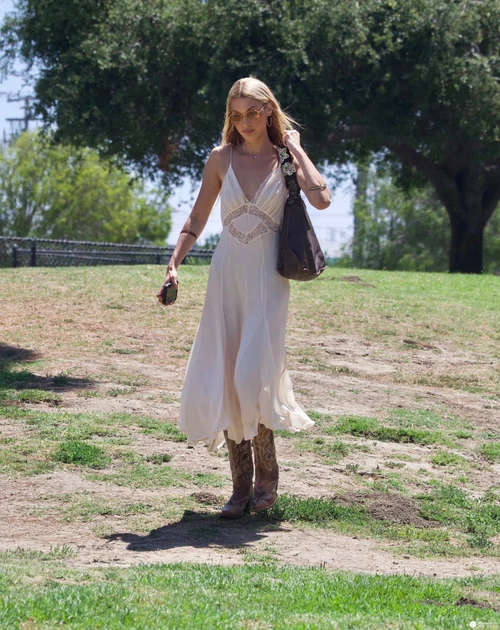Bella Hadid OOTD: Bohemian Maxi Dress Paired with Cowboy Boots for a Chic Outdoor Look