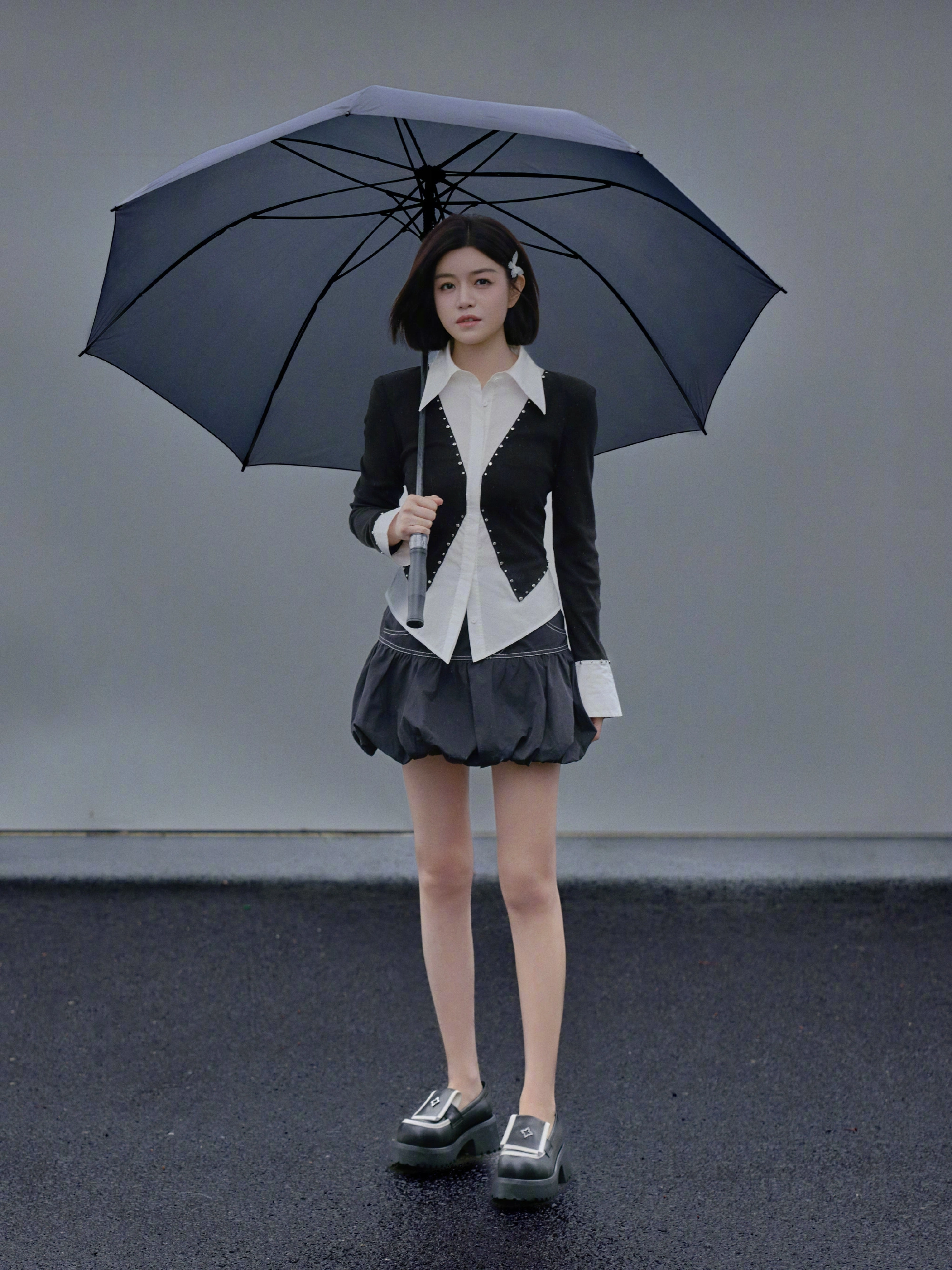 Chic Black and White Blazer Ensemble with Voluminous Skirt and Modern Loafers