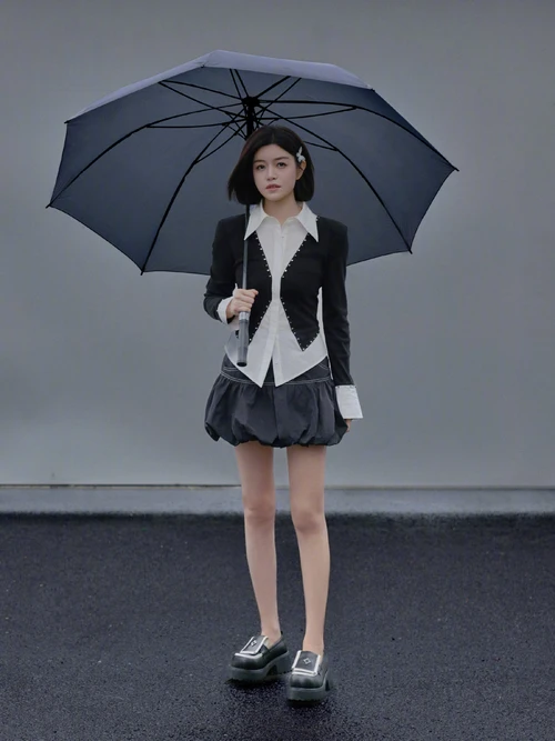 Chic Black and White Blazer Ensemble with Voluminous Skirt and Modern Loafers